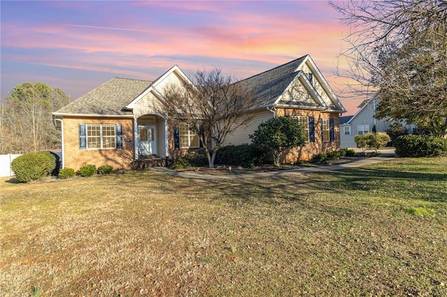 view of front of house with a yard