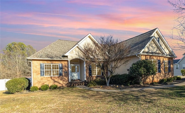 view of front of house with a yard