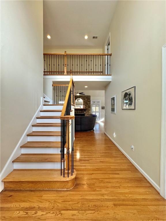 stairway featuring hardwood / wood-style floors