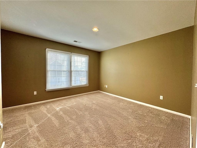 spare room featuring carpet floors