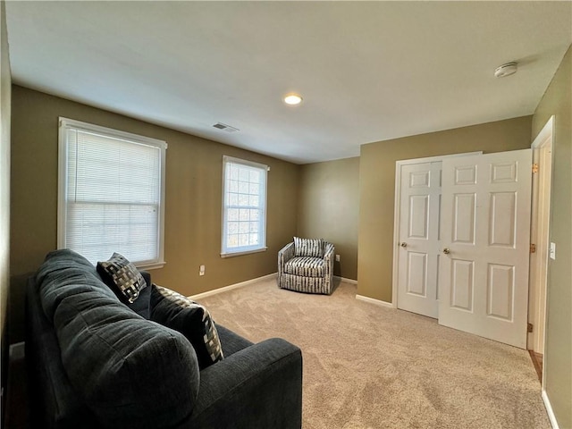 living room featuring light carpet