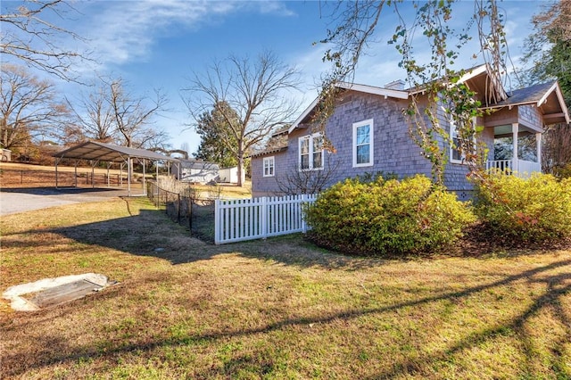 view of property exterior featuring a lawn and a carport