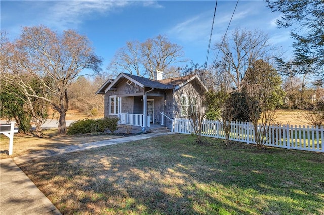 bungalow-style home featuring a porch and a front yard