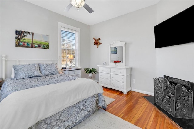 bedroom featuring light hardwood / wood-style floors and ceiling fan