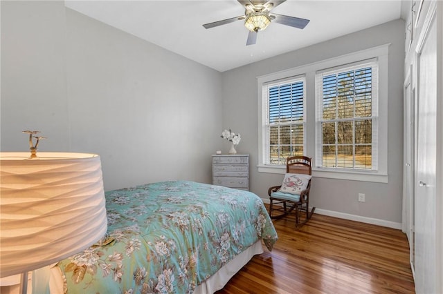 bedroom featuring hardwood / wood-style floors and ceiling fan