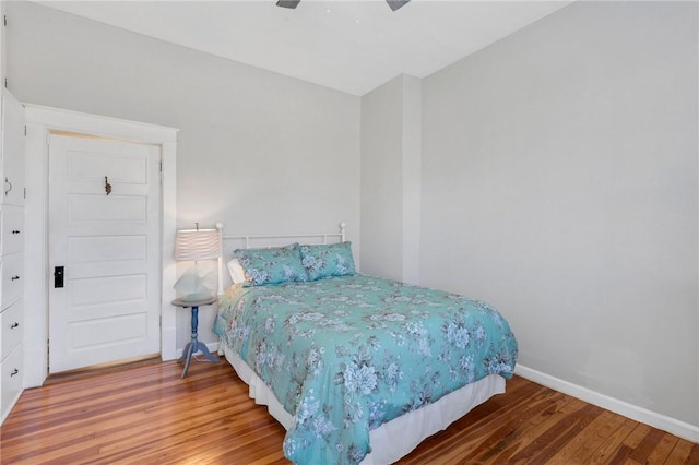 bedroom featuring hardwood / wood-style flooring and ceiling fan