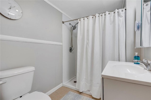 bathroom with vanity, toilet, crown molding, tile patterned floors, and a shower with curtain