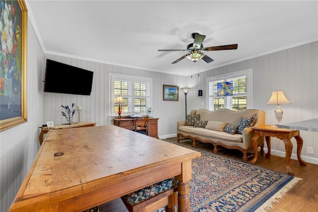 living room with crown molding, dark hardwood / wood-style floors, a wealth of natural light, and ceiling fan