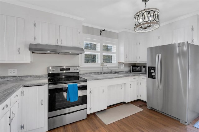 kitchen with hanging light fixtures, stainless steel appliances, sink, and white cabinets