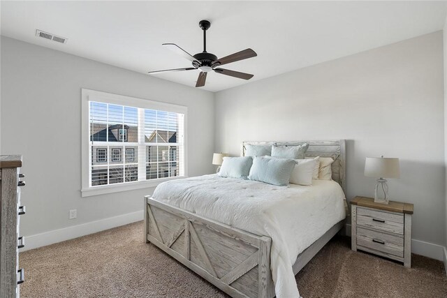 bedroom featuring ceiling fan and carpet