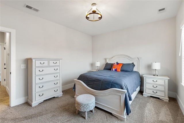 bedroom with light colored carpet