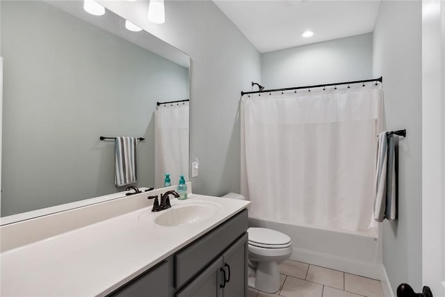 full bathroom featuring tile patterned flooring, vanity, shower / tub combo, and toilet