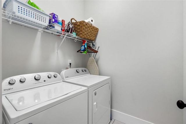 laundry room with washing machine and clothes dryer