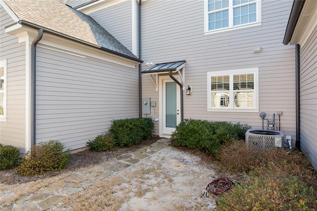 property entrance featuring central air condition unit