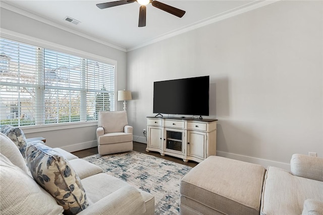 living room featuring ceiling fan, ornamental molding, and wood-type flooring