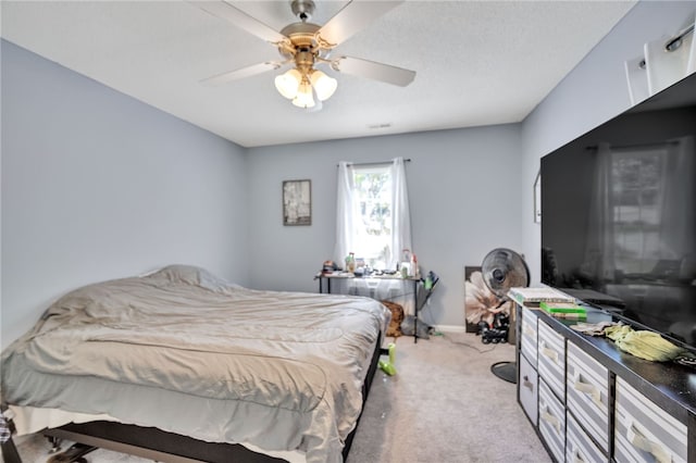 bedroom featuring light colored carpet and ceiling fan