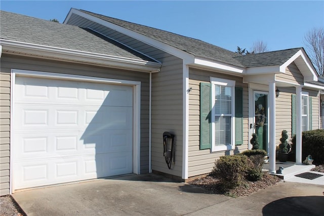 doorway to property with a garage