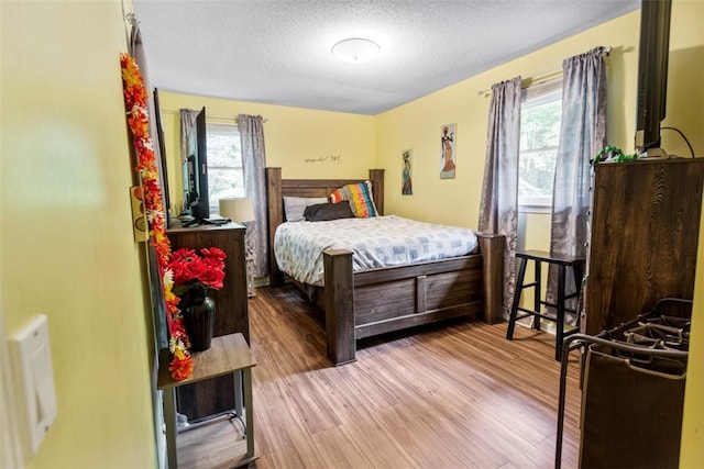 6 Ivy Ct, Seneca, SC 29678 - bedroom featuring a textured ceiling and light hardwood / wood-style floors