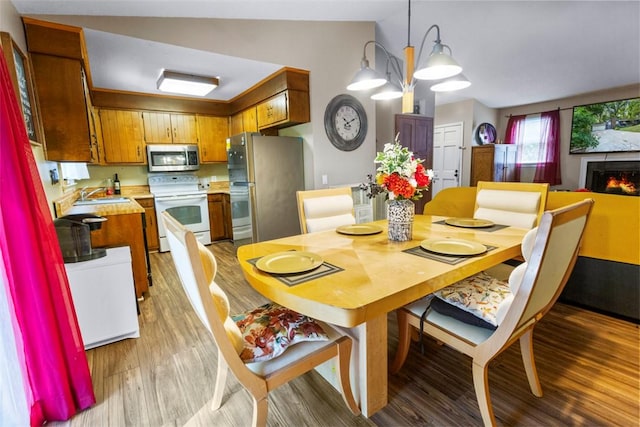 6 Ivy Ct, Seneca, SC 29678 - dining space with lofted ceiling, sink, and light wood-type flooring