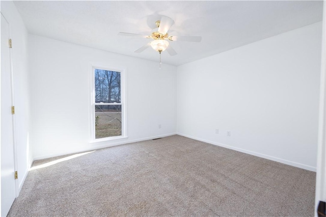 empty room with carpet and ceiling fan