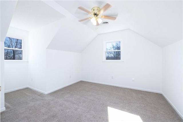 bonus room with ceiling fan, light colored carpet, and lofted ceiling