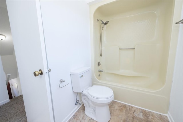 bathroom with shower / washtub combination and toilet