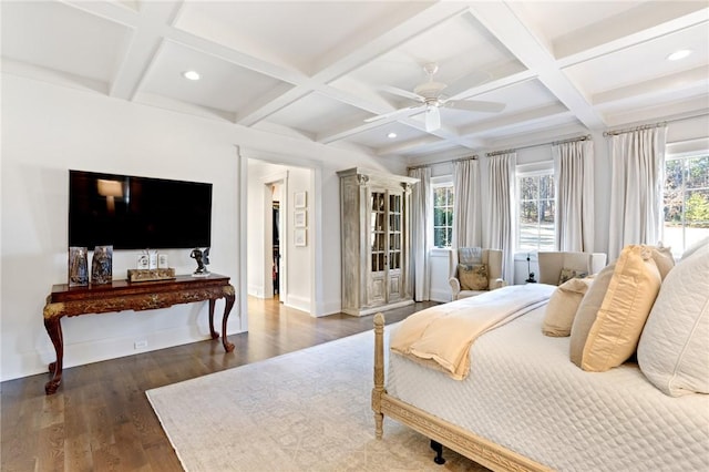 bedroom featuring coffered ceiling, dark wood-type flooring, beamed ceiling, and ceiling fan