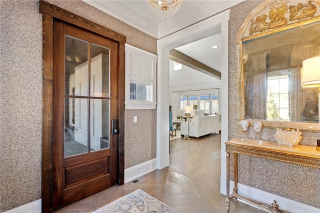 foyer with an inviting chandelier