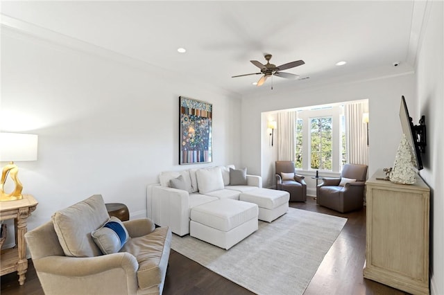 living room featuring crown molding, ceiling fan, and hardwood / wood-style flooring