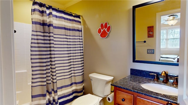 full bathroom featuring vanity, toilet, and shower / bath combo with shower curtain