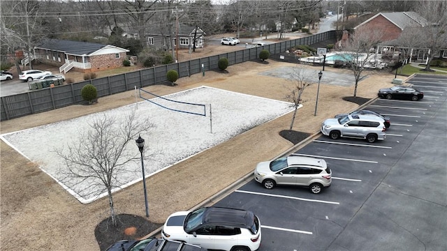 view of parking featuring volleyball court