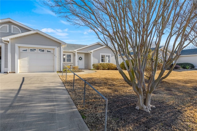 ranch-style home featuring a garage and a front yard