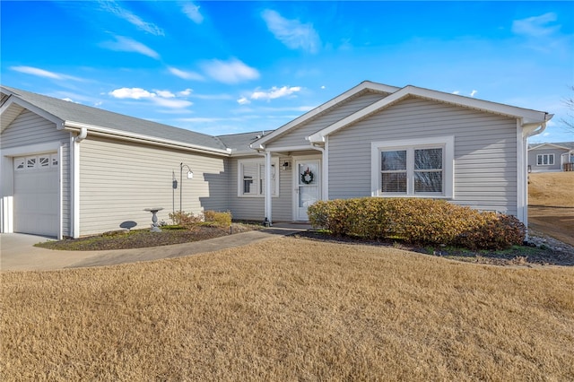 single story home with a garage and a front yard