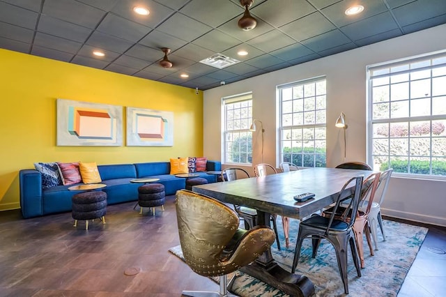 dining area with a paneled ceiling