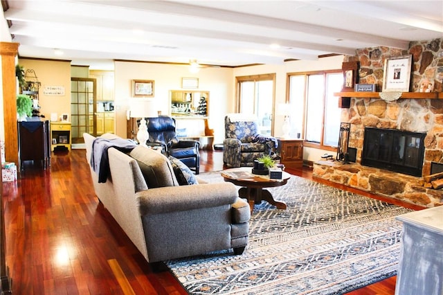 living room with beam ceiling, dark wood-type flooring, and a fireplace