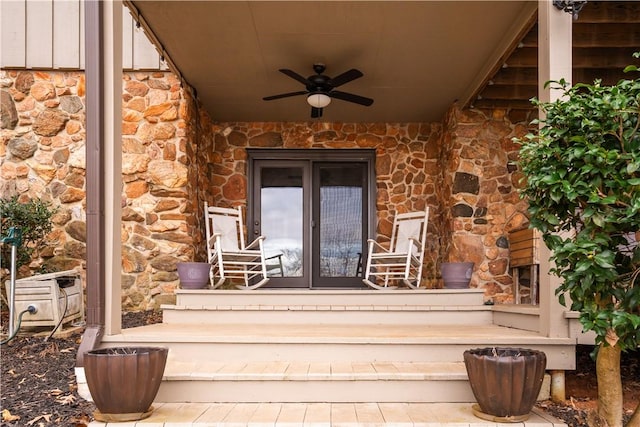 view of exterior entry with ceiling fan