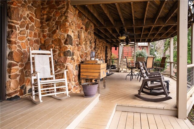 wooden deck featuring ceiling fan