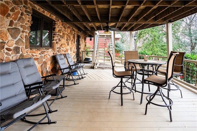 wooden deck featuring ceiling fan