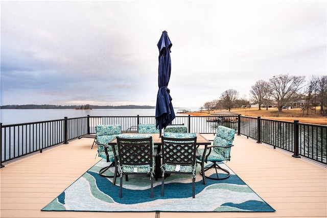 wooden deck featuring a water view