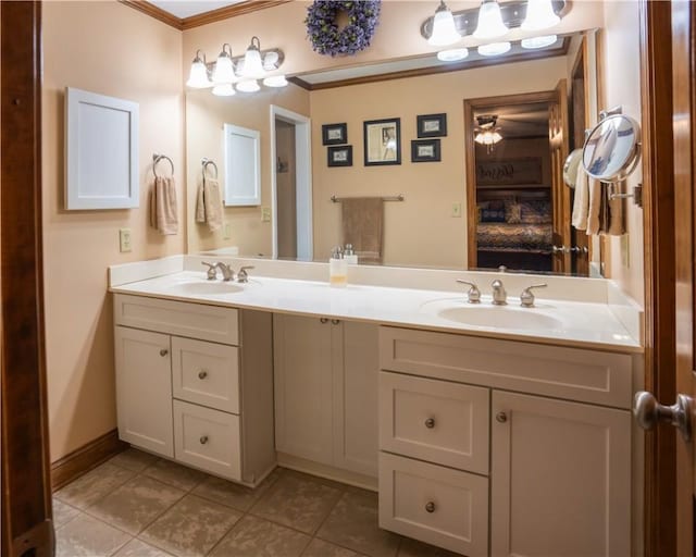 bathroom featuring crown molding, vanity, and tile patterned flooring