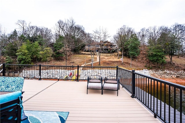 deck featuring a water view