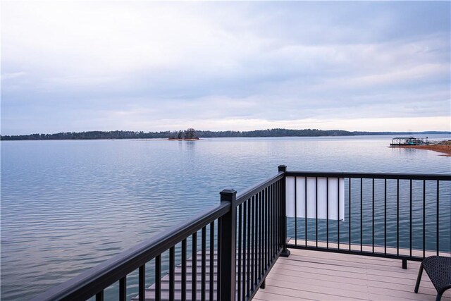 wooden terrace with a water view