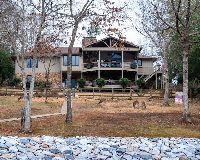 back of property with a sunroom