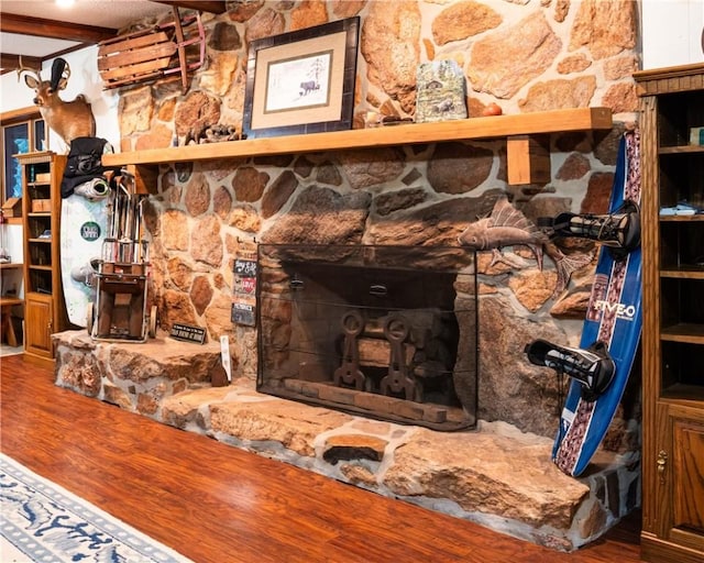 details featuring hardwood / wood-style floors and a fireplace