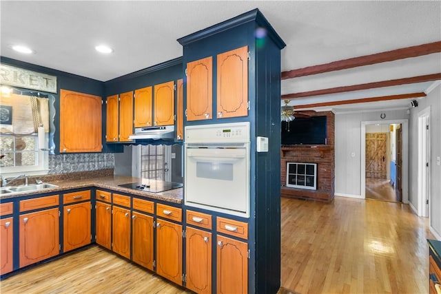 109 Pine Tree Ln, Anderson, SC 29625 - kitchen featuring sink, tasteful backsplash, black electric stovetop, a fireplace, and oven