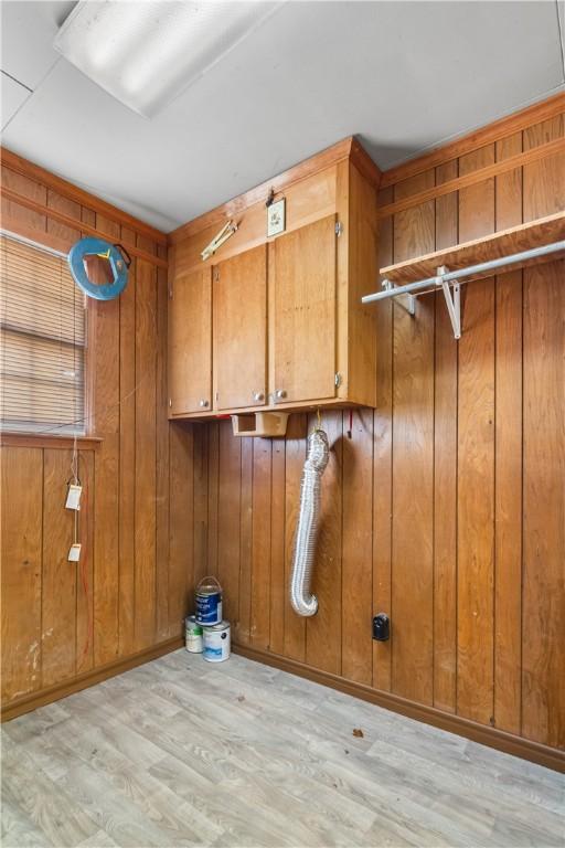 109 Pine Tree Ln, Anderson, SC 29625 - laundry room featuring light hardwood / wood-style floors, cabinets, and wood walls