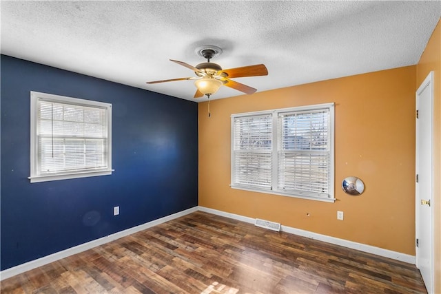 109 Pine Tree Ln, Anderson, SC 29625 - spare room with ceiling fan, dark wood-type flooring, and a textured ceiling