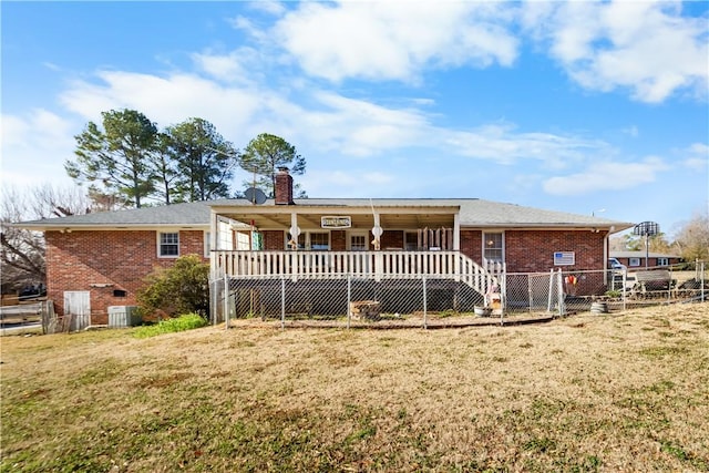 109 Pine Tree Ln, Anderson, SC 29625 - rear view of house with central AC, a lawn, and covered porch