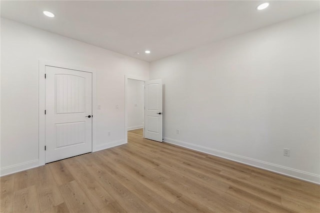 unfurnished bedroom featuring light wood-type flooring