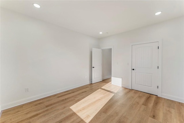 unfurnished bedroom featuring light wood-type flooring